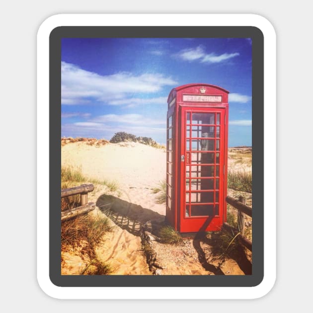 Red phone box on the beach Sticker by Lionik09